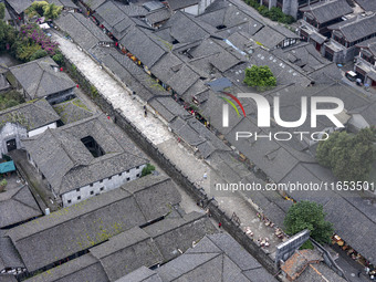 An aerial photo taken in Dujiangyan, China, on October 9, 2024, shows the ancient city complex of Guxian County in Dujiangyan City, Sichuan...