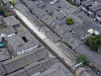 An aerial photo taken in Dujiangyan, China, on October 9, 2024, shows the ancient city complex of Guxian County in Dujiangyan City, Sichuan...