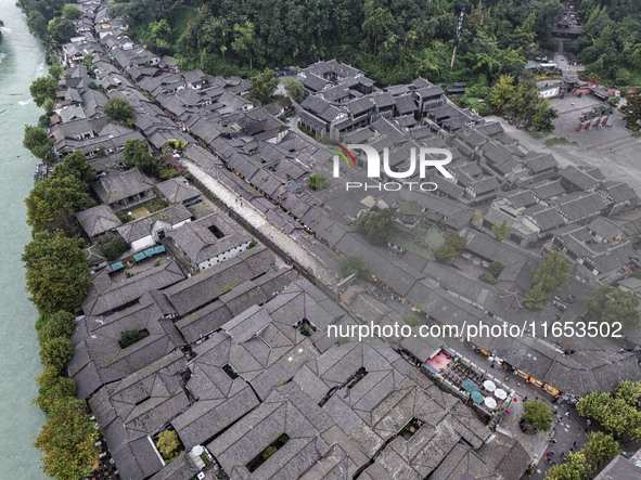 An aerial photo taken in Dujiangyan, China, on October 9, 2024, shows the ancient city complex of Guxian County in Dujiangyan City, Sichuan...