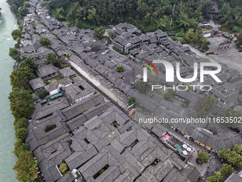 An aerial photo taken in Dujiangyan, China, on October 9, 2024, shows the ancient city complex of Guxian County in Dujiangyan City, Sichuan...