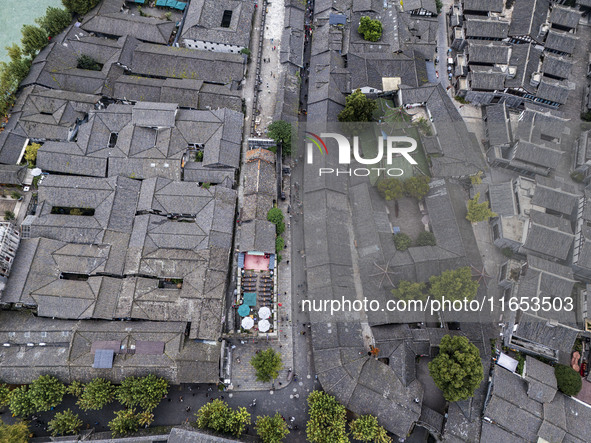 An aerial photo taken in Dujiangyan, China, on October 9, 2024, shows the ancient city complex of Guxian County in Dujiangyan City, Sichuan...