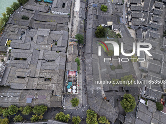 An aerial photo taken in Dujiangyan, China, on October 9, 2024, shows the ancient city complex of Guxian County in Dujiangyan City, Sichuan...