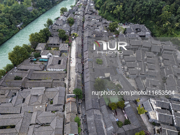 An aerial photo taken in Dujiangyan, China, on October 9, 2024, shows the ancient city complex of Guxian County in Dujiangyan City, Sichuan...