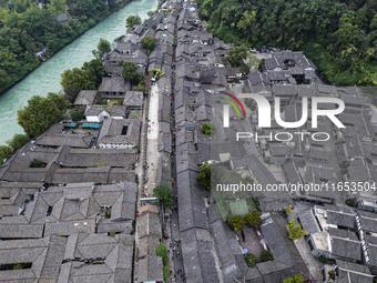 An aerial photo taken in Dujiangyan, China, on October 9, 2024, shows the ancient city complex of Guxian County in Dujiangyan City, Sichuan...