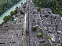 An aerial photo taken in Dujiangyan, China, on October 9, 2024, shows the ancient city complex of Guxian County in Dujiangyan City, Sichuan...