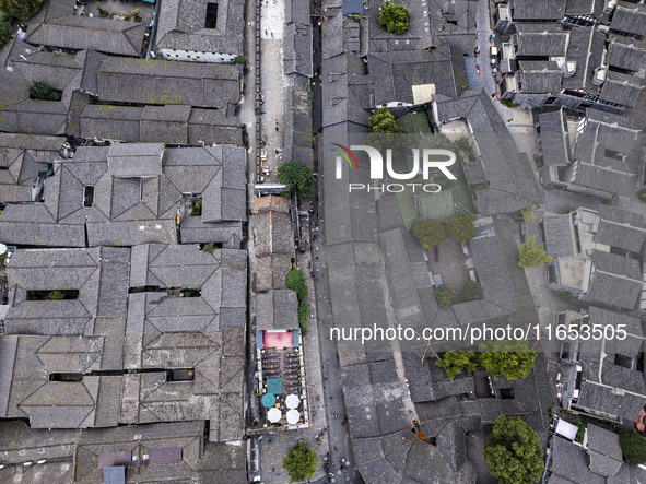 An aerial photo taken in Dujiangyan, China, on October 9, 2024, shows the ancient city complex of Guxian County in Dujiangyan City, Sichuan...