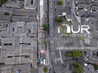 An aerial photo taken in Dujiangyan, China, on October 9, 2024, shows the ancient city complex of Guxian County in Dujiangyan City, Sichuan...