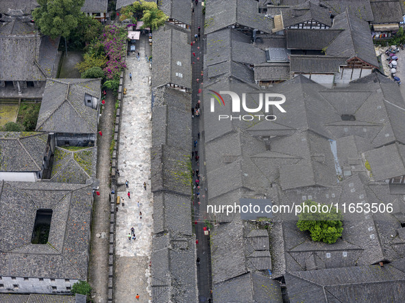 An aerial photo taken in Dujiangyan, China, on October 9, 2024, shows the ancient city complex of Guxian County in Dujiangyan City, Sichuan...