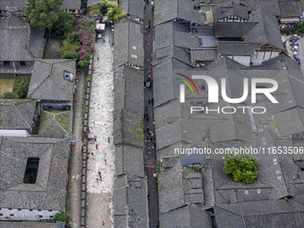 An aerial photo taken in Dujiangyan, China, on October 9, 2024, shows the ancient city complex of Guxian County in Dujiangyan City, Sichuan...