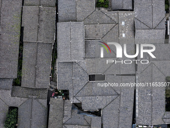 An aerial photo taken in Dujiangyan, China, on October 9, 2024, shows the ancient city complex of Guxian County in Dujiangyan City, Sichuan...