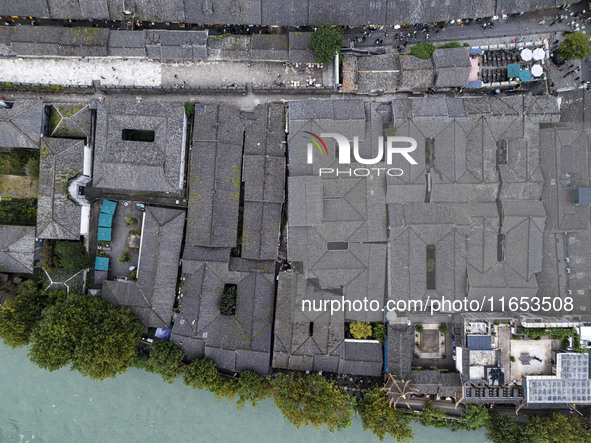 An aerial photo taken in Dujiangyan, China, on October 9, 2024, shows the ancient city complex of Guxian County in Dujiangyan City, Sichuan...