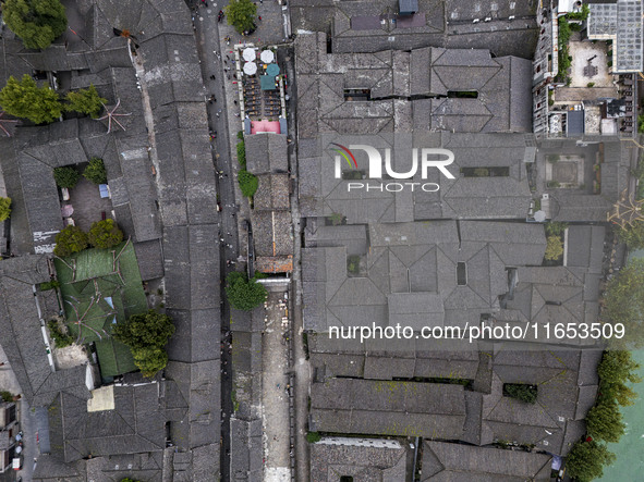 An aerial photo taken in Dujiangyan, China, on October 9, 2024, shows the ancient city complex of Guxian County in Dujiangyan City, Sichuan...