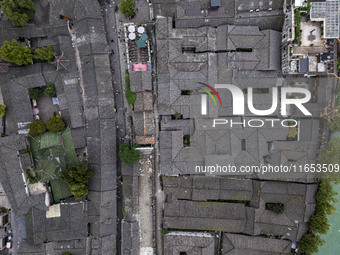 An aerial photo taken in Dujiangyan, China, on October 9, 2024, shows the ancient city complex of Guxian County in Dujiangyan City, Sichuan...