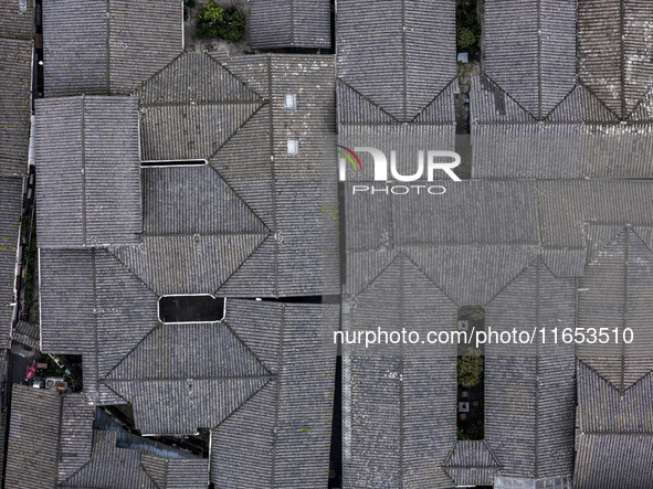 An aerial photo taken in Dujiangyan, China, on October 9, 2024, shows the ancient city complex of Guxian County in Dujiangyan City, Sichuan...