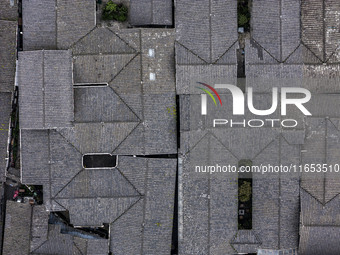 An aerial photo taken in Dujiangyan, China, on October 9, 2024, shows the ancient city complex of Guxian County in Dujiangyan City, Sichuan...