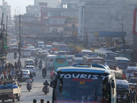 A vehicle departs from the capital, Kathmandu, covering a lane on a highway that leads out of the Kathmandu Valley in Kathmandu, Nepal, on O...