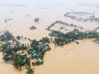 Heavy rains and water from upstream cause severe flooding in Sherpur, Bangladesh, on October 5, 2024, submerging houses. Seven deaths are re...