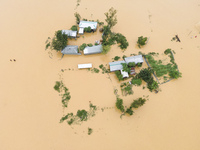 Heavy rains and water from upstream India submerge homes in a village in Jhenaigati upazila of Sherpur district, Bangladesh, on October 5, 2...