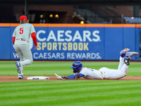 Mark Vientos #27 of the New York Mets doubles during the second inning in Game 4 of a baseball NL Division Series against the Philadelphia P...