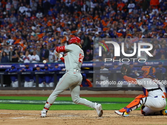 Alec Bohm #28 of the Philadelphia Phillies drives in a run on a fielder's choice during the fourth inning in Game 4 of the baseball NL Divis...