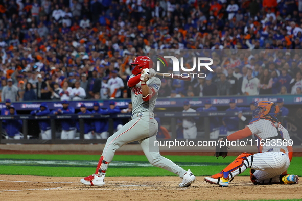 Alec Bohm #28 of the Philadelphia Phillies drives in a run on a fielder's choice during the fourth inning in Game 4 of the baseball NL Divis...