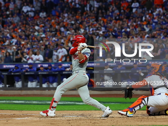 Alec Bohm #28 of the Philadelphia Phillies drives in a run on a fielder's choice during the fourth inning in Game 4 of the baseball NL Divis...