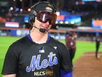 Pete Alonso #20 of the New York Mets celebrates with a teammate after winning the NL Division Series against the Philadelphia Phillies at Ci...