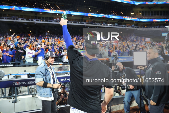 Pete Alonso #20 of the New York Mets celebrates with a teammate after winning the NL Division Series against the Philadelphia Phillies at Ci...