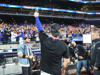 Pete Alonso #20 of the New York Mets celebrates with a teammate after winning the NL Division Series against the Philadelphia Phillies at Ci...