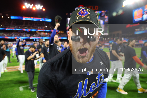 Harrison Bader #44 of the New York Mets celebrates with a teammate after winning the NL Division Series against the Philadelphia Phillies at...