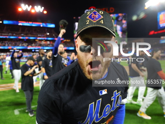 Harrison Bader #44 of the New York Mets celebrates with a teammate after winning the NL Division Series against the Philadelphia Phillies at...