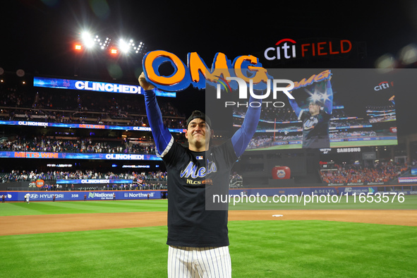 Jose Iglesias #11 of the New York Mets celebrates with a teammate after winning the NL Division Series against the Philadelphia Phillies at...