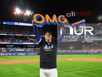 Jose Iglesias #11 of the New York Mets celebrates with a teammate after winning the NL Division Series against the Philadelphia Phillies at...