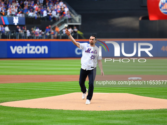 Former New York Mets stars Daniel Murphy and Bartolo Colon participate in the ceremonial first pitch before Game 4 of the baseball NL Divisi...