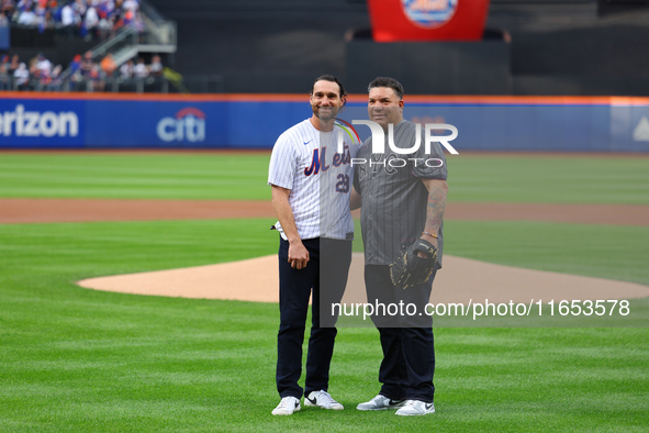 Former New York Mets stars Daniel Murphy and Bartolo Colon participate in the ceremonial first pitch before Game 4 of the baseball NL Divisi...