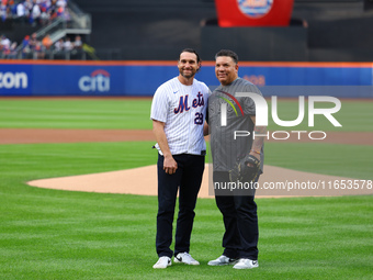 Former New York Mets stars Daniel Murphy and Bartolo Colon participate in the ceremonial first pitch before Game 4 of the baseball NL Divisi...