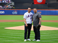 Former New York Mets stars Daniel Murphy and Bartolo Colon participate in the ceremonial first pitch before Game 4 of the baseball NL Divisi...