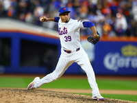 New York Mets relief pitcher Edwin Diaz #39 throws during the ninth inning in Game 4 of a baseball NL Division Series against the Philadelph...