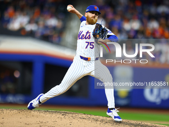 New York Mets relief pitcher Reed Garrett #75 throws during the sixth inning in Game 4 of a baseball NL Division Series against the Philadel...