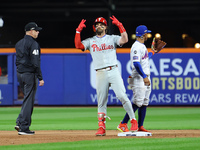 Philadelphia Phillies' Bryce Harper #3 gestures to the bench after doubling during the sixth inning in Game 4 of the baseball NL Division Se...