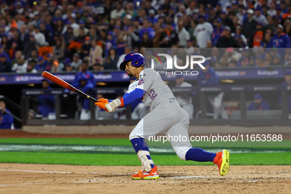 Francisco Lindor #12 of the New York Mets doubles during the fifth inning in Game 4 of the baseball NL Division Series against the Philadelp...