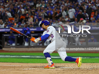 Francisco Lindor #12 of the New York Mets doubles during the fifth inning in Game 4 of the baseball NL Division Series against the Philadelp...