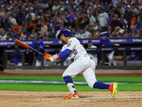 Francisco Lindor #12 of the New York Mets doubles during the fifth inning in Game 4 of the baseball NL Division Series against the Philadelp...