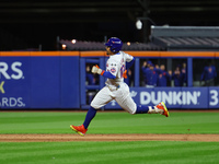 Francisco Lindor #12 of the New York Mets doubles during the fifth inning in Game 4 of the baseball NL Division Series against the Philadelp...