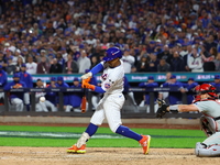 New York Mets player Francisco Lindor #12 hits a grand slam home run during the sixth inning in Game 4 of a baseball NL Division Series agai...