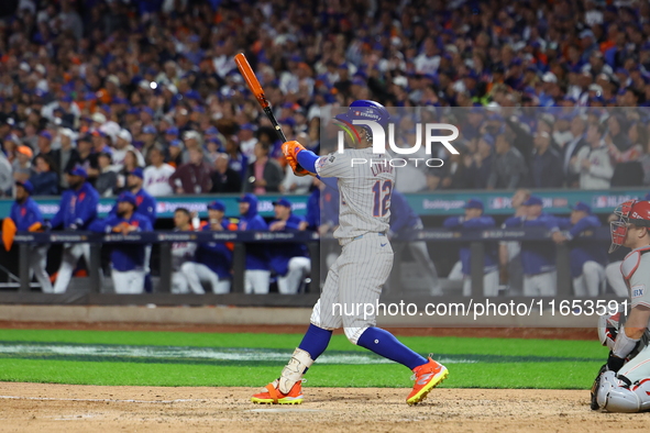 New York Mets player Francisco Lindor #12 hits a grand slam home run during the sixth inning in Game 4 of a baseball NL Division Series agai...