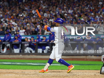 New York Mets player Francisco Lindor #12 hits a grand slam home run during the sixth inning in Game 4 of a baseball NL Division Series agai...