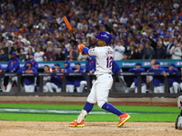 New York Mets player Francisco Lindor #12 hits a grand slam home run during the sixth inning in Game 4 of a baseball NL Division Series agai...