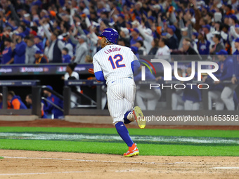 New York Mets player Francisco Lindor #12 hits a grand slam home run during the sixth inning in Game 4 of a baseball NL Division Series agai...