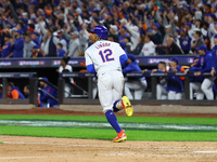 New York Mets player Francisco Lindor #12 hits a grand slam home run during the sixth inning in Game 4 of a baseball NL Division Series agai...